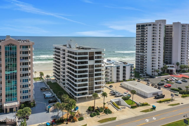 bird's eye view with a view of the beach and a water view