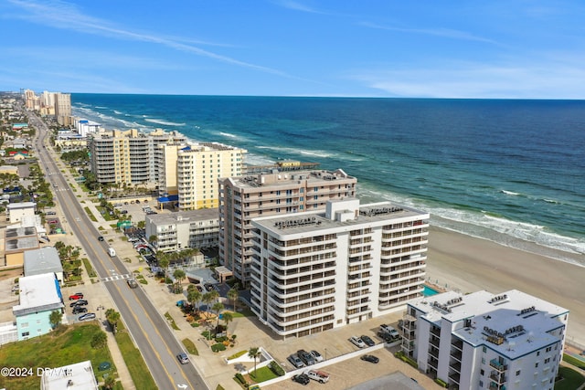 drone / aerial view featuring a view of the beach and a water view