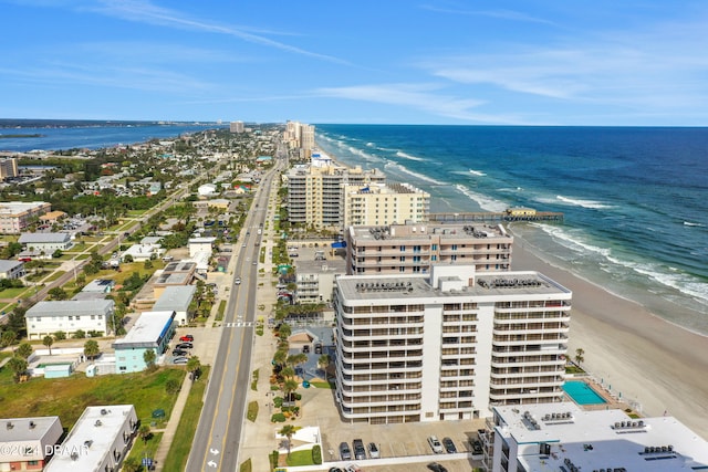 bird's eye view featuring a water view and a view of the beach