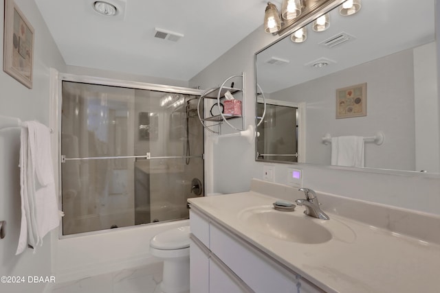 full bathroom with toilet, combined bath / shower with glass door, and vanity