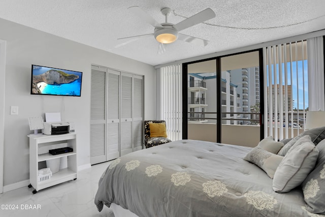 bedroom with ceiling fan, a textured ceiling, a closet, and access to exterior