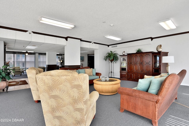 living room with dark colored carpet, a textured ceiling, and crown molding