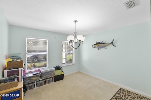 dining room featuring visible vents, baseboards, carpet, and an inviting chandelier