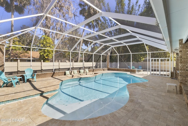 view of pool featuring a lanai, a fenced in pool, a patio, and a fenced backyard