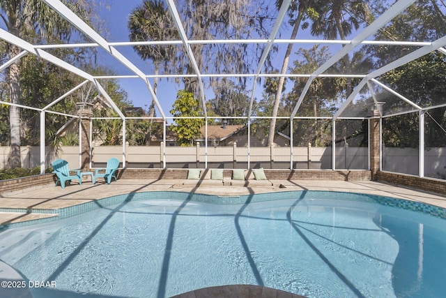 view of pool with a lanai, a fenced in pool, a patio, and a fenced backyard