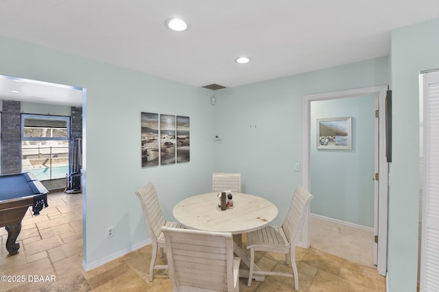 dining room featuring stone tile floors, recessed lighting, billiards, and baseboards