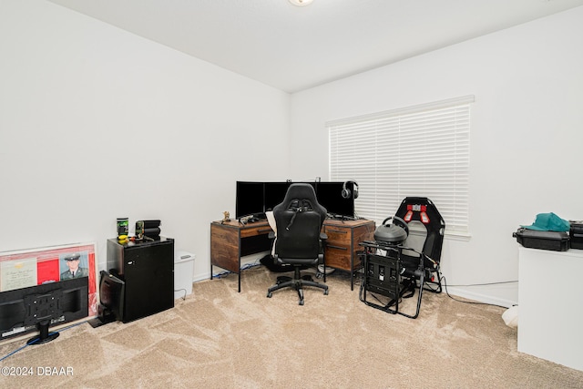 carpeted office featuring baseboards