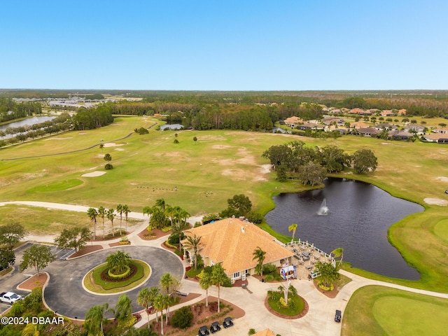 aerial view with a residential view, a water view, and golf course view