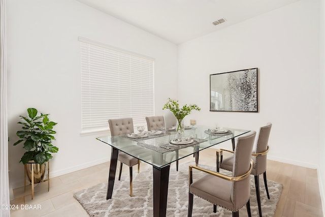 dining area with baseboards and visible vents