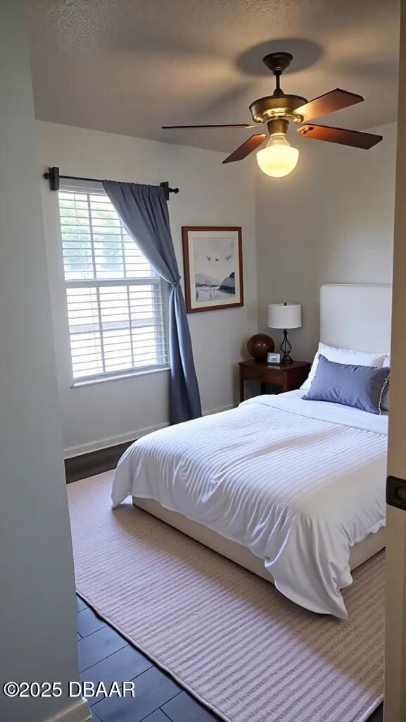 1500 Manor Dr, Daytona Beach, FL 32114 - bedroom with ceiling fan and baseboards