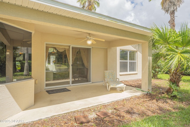 exterior space with ceiling fan