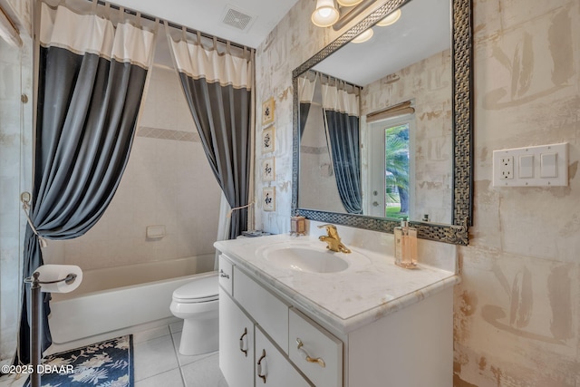 full bathroom featuring tile patterned flooring, vanity, toilet, and shower / bath combo with shower curtain