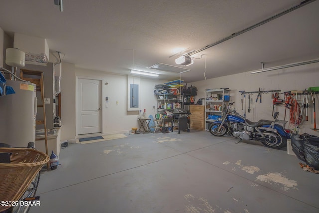 garage with electric panel, a garage door opener, and water heater