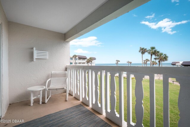 balcony featuring a water view