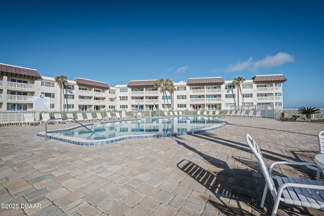 view of swimming pool featuring a patio