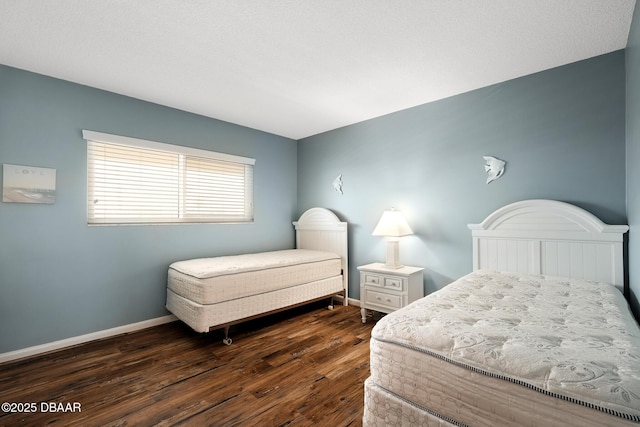 bedroom featuring dark hardwood / wood-style floors