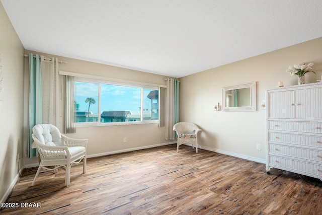 living area with wood-type flooring