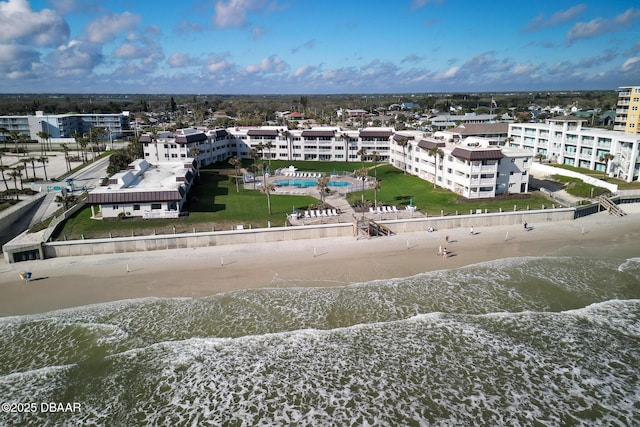 drone / aerial view with a water view and a view of the beach