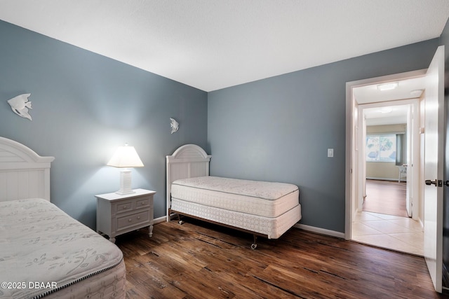 bedroom featuring dark hardwood / wood-style flooring