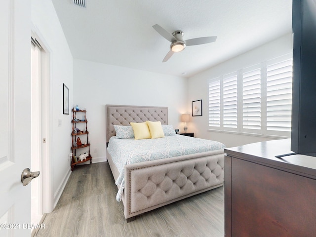 bedroom featuring light hardwood / wood-style floors and ceiling fan