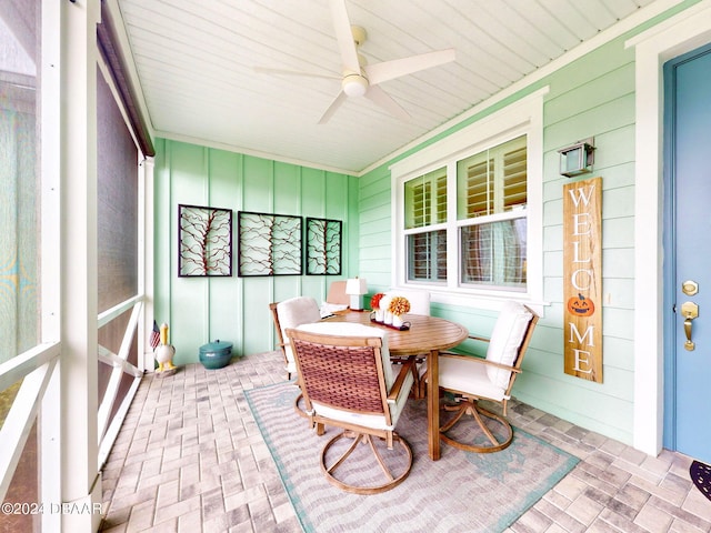 sunroom / solarium with ceiling fan