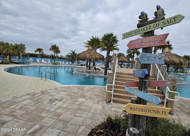 view of swimming pool featuring a patio area