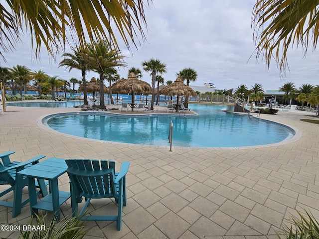 view of pool with a patio area and a gazebo