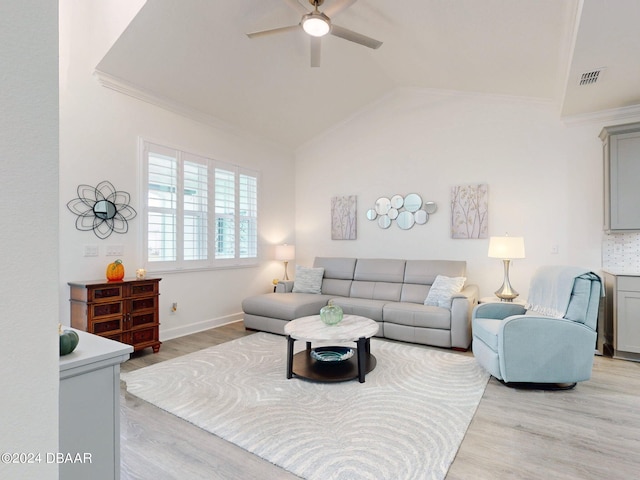 living room featuring ornamental molding, light hardwood / wood-style floors, lofted ceiling, and ceiling fan