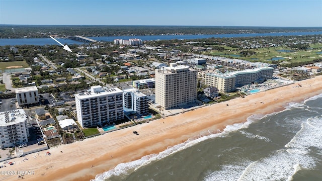 aerial view featuring a water view, a view of city, and a view of the beach