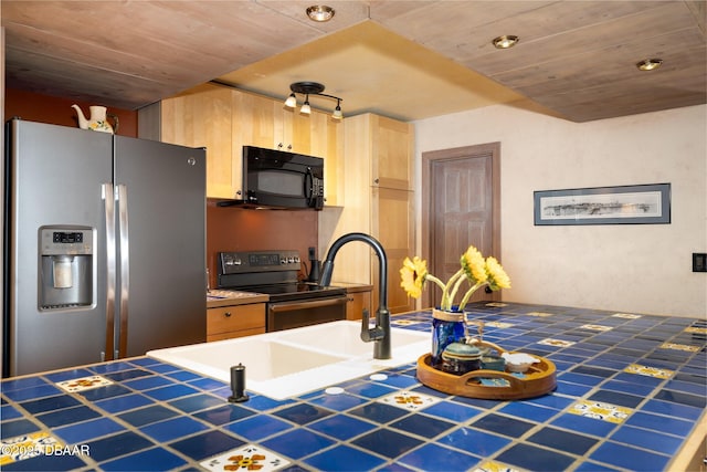 kitchen with tile counters, wood ceiling, light brown cabinetry, and stainless steel appliances