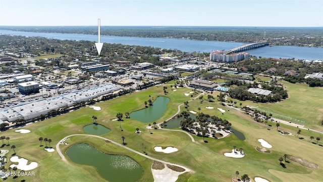 bird's eye view with view of golf course and a water view