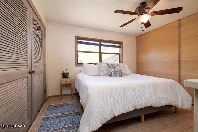 bedroom featuring ceiling fan and light tile patterned flooring