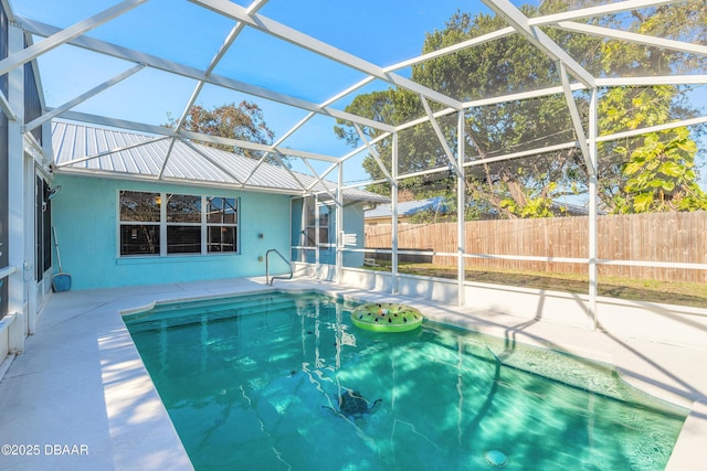 view of pool featuring a lanai and a patio