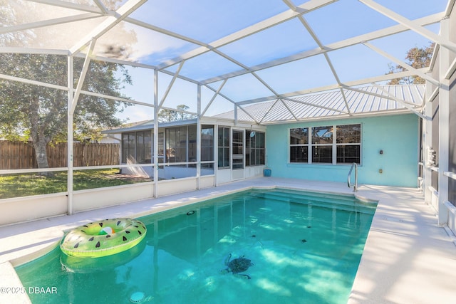 view of pool featuring a lanai and a sunroom