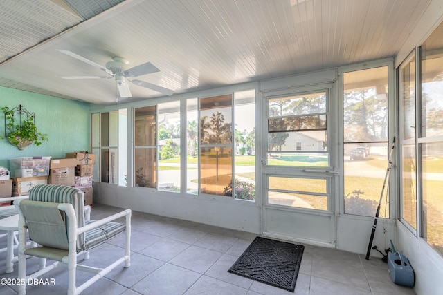 sunroom with ceiling fan and plenty of natural light