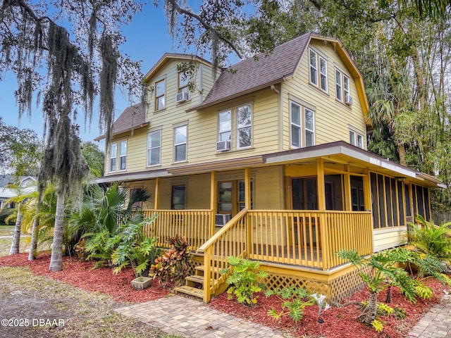 view of front of home featuring a porch and cooling unit