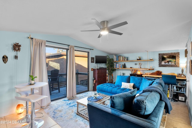 tiled living room featuring ceiling fan and lofted ceiling