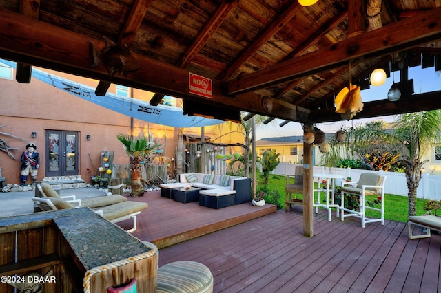 deck featuring a gazebo, outdoor lounge area, and french doors