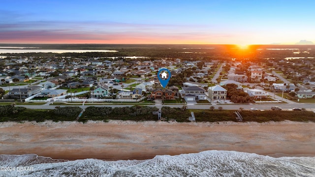 snowy aerial view featuring a water view