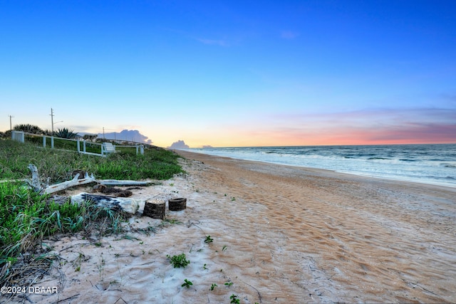 property view of water featuring a beach view