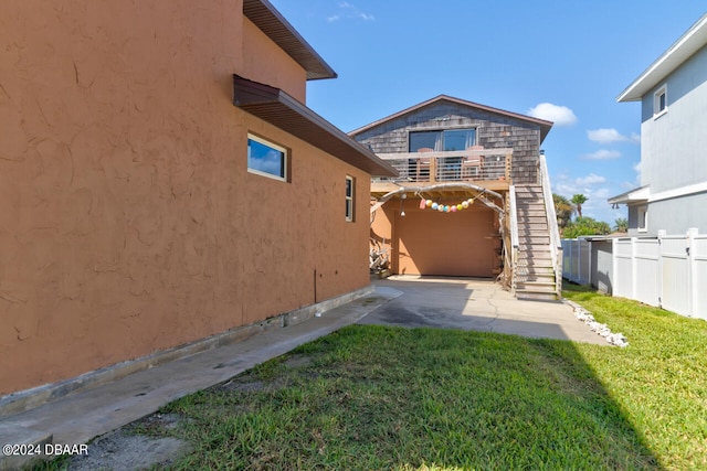 rear view of property featuring a lawn