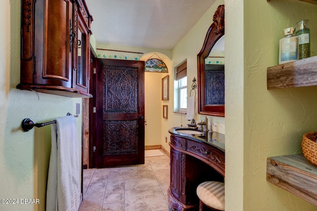 bathroom featuring tile patterned floors and vanity