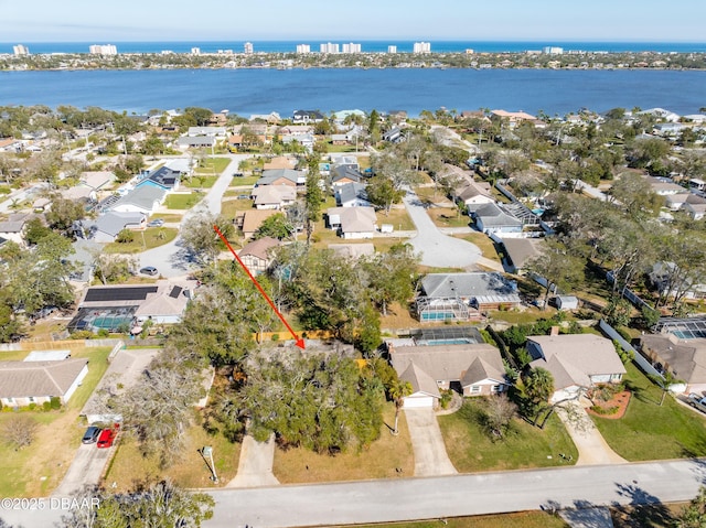 drone / aerial view with a water view