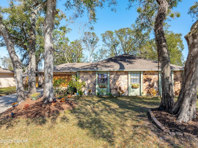 ranch-style house with a front lawn