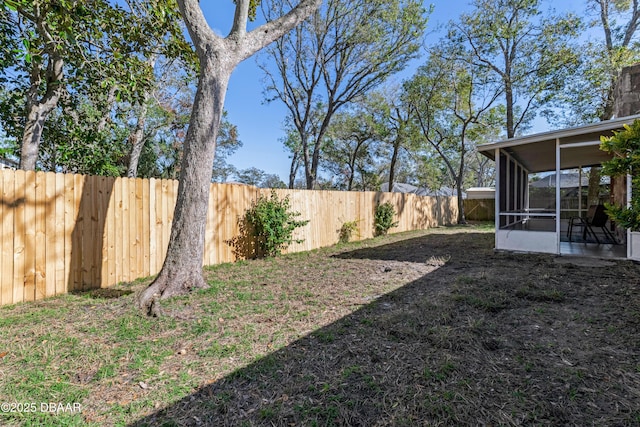 view of yard featuring a sunroom