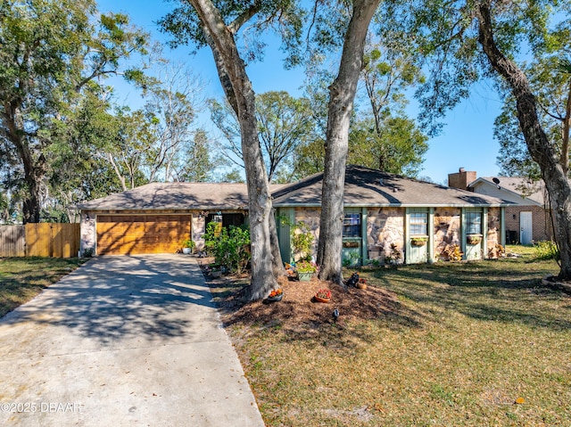 single story home with a garage and a front yard