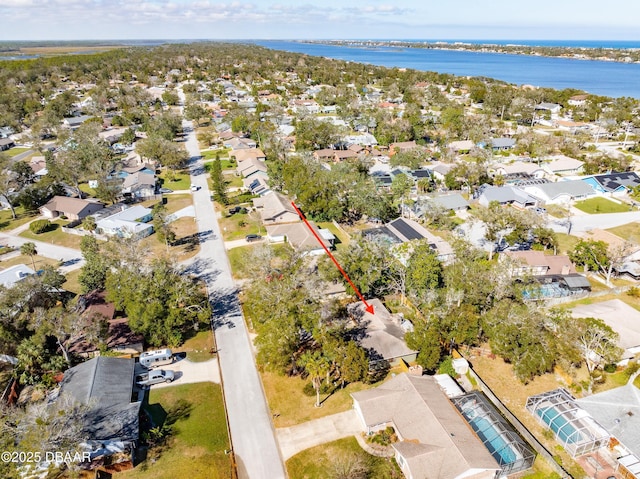 drone / aerial view with a water view