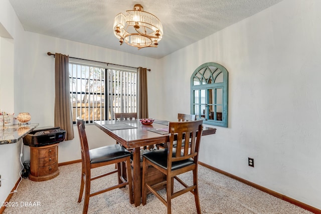 carpeted dining space featuring a textured ceiling and an inviting chandelier