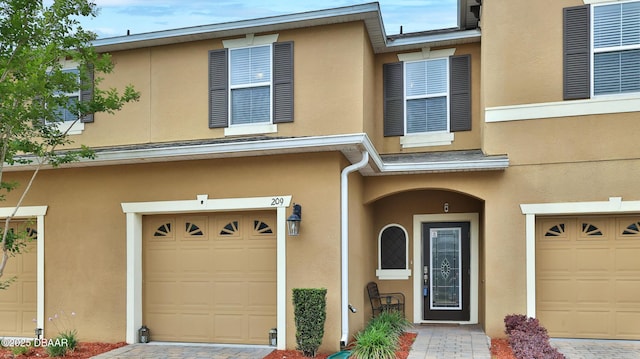 view of front of property with a garage