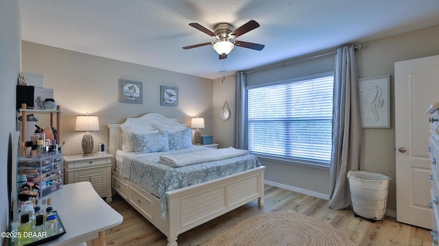 bedroom featuring ceiling fan and light wood-type flooring